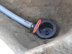 The drain should be at the lowest point of your pond