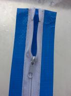 A QSR Zipper sticks onto the poly and an opening is cut